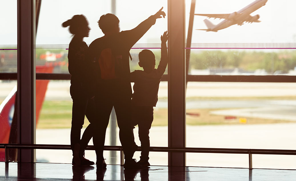 Blog photo_family at airport watching plane take off_Travel Insurance