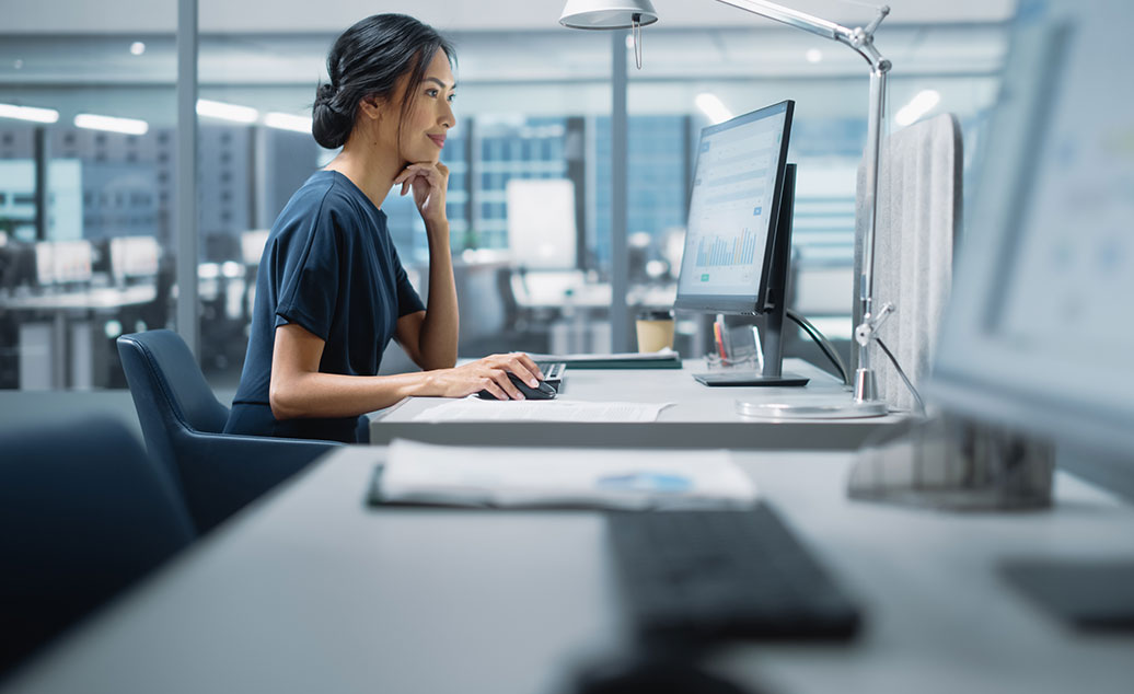 Business Woman Sitting At Computer Work Station