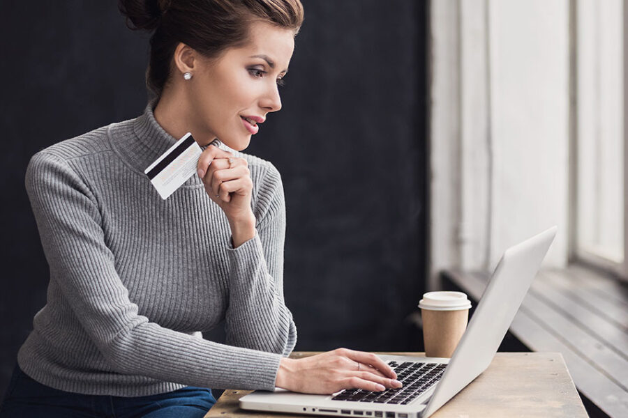Woman with credit card shopping online