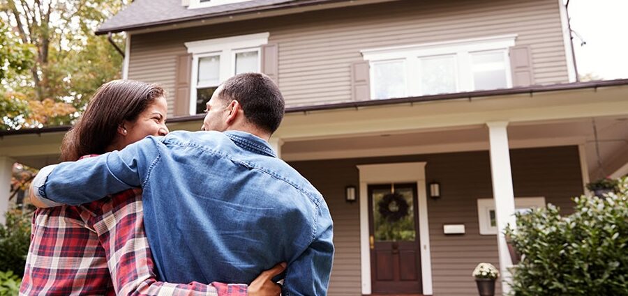 a family that is happy because learned how to buy a home