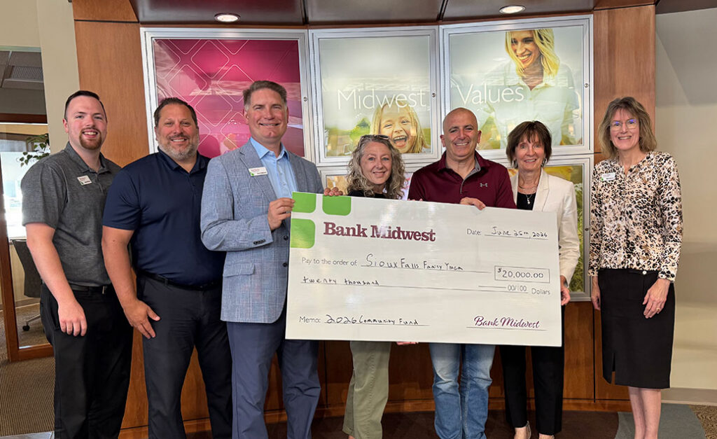 Bank Midwest representatives presenting $20,000 check to Sioux Falls Family YMCA for Camp Leif Ericson Treehouse project.