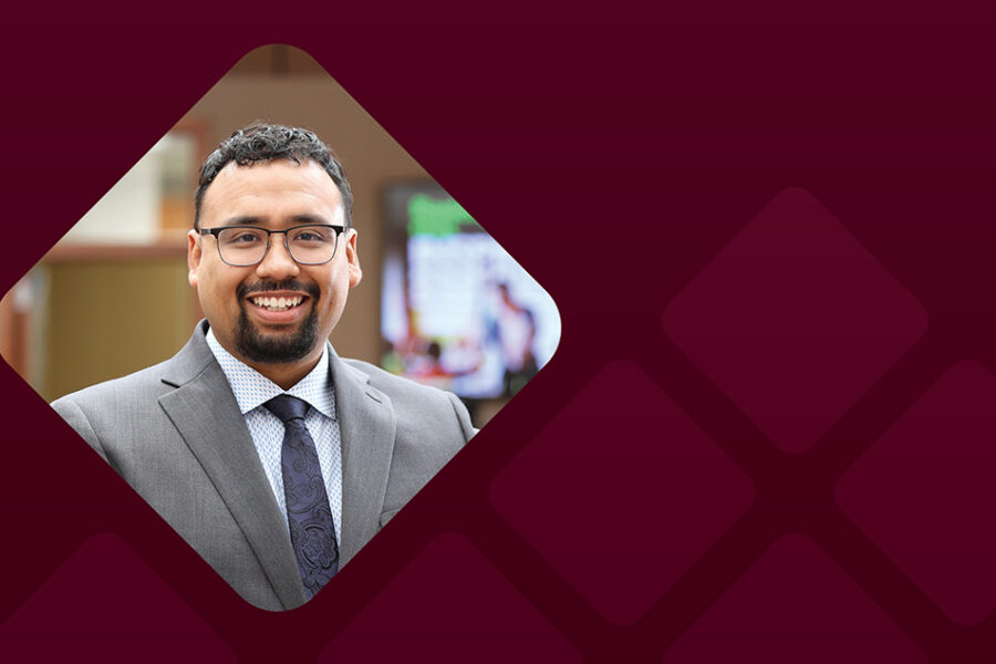 Allan Hernandex headshot with burgundy background