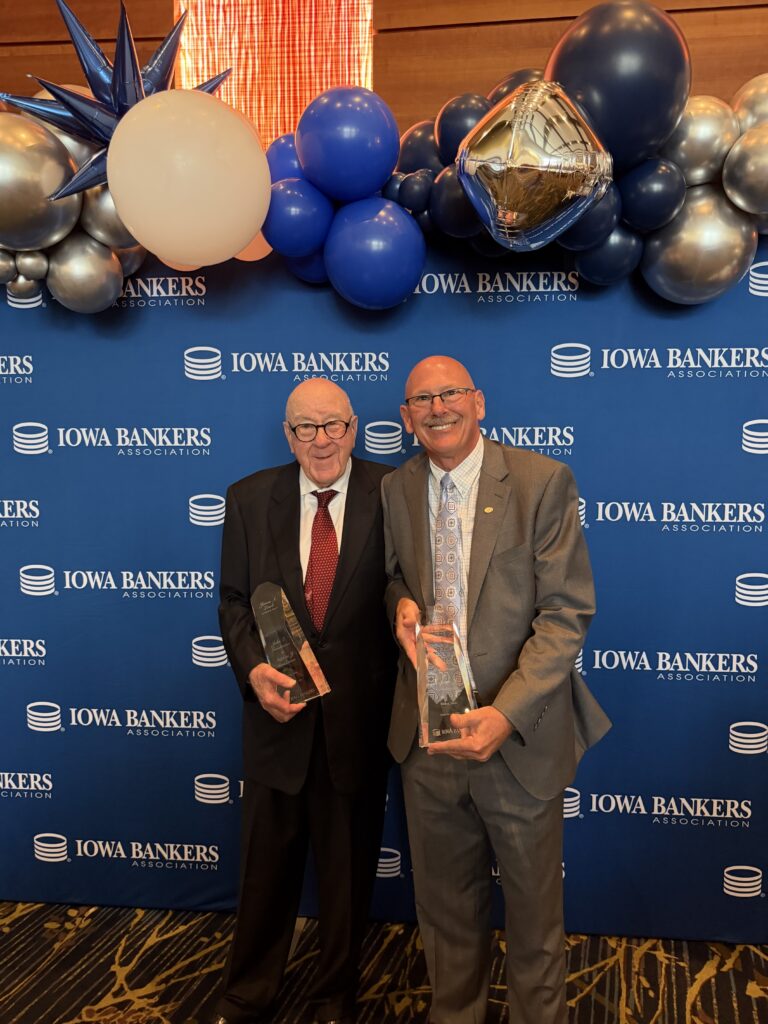 John Goodenow and Steve Goodenow holding the Leach Awards at the Iowa Bankers Association.